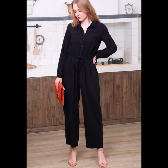 Black cotton utility button down jumpsuit.